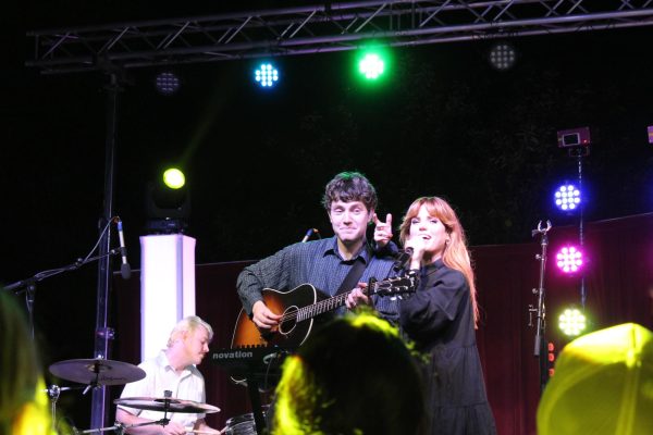 Noah Sierota and Sydney Quiseng of Echosmith singing a duet during a September 19, 2025 concert on the Falcon Center Quad.